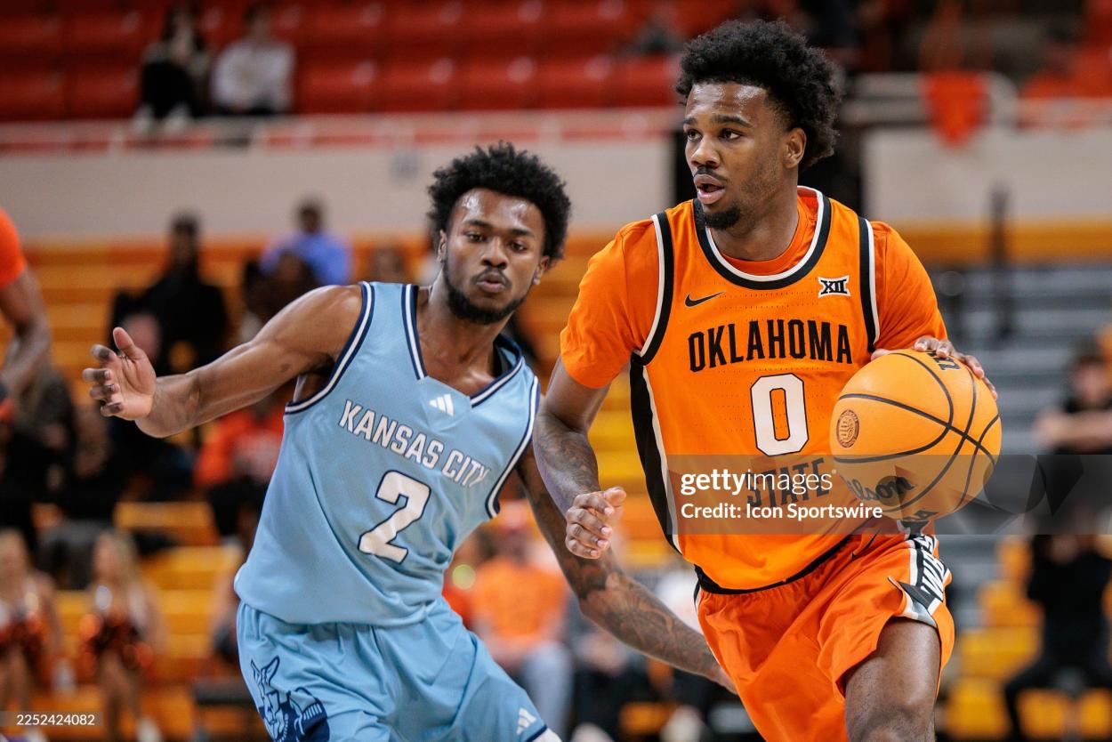 Jaylen Curry of Oklahoma State drives the lane against Kansas City